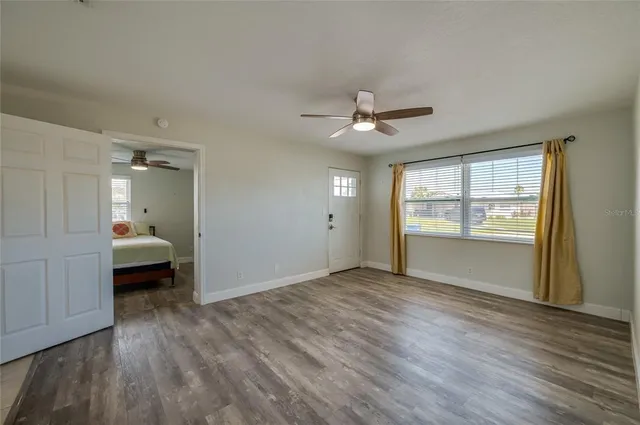 a kitchen with stainless steel appliances granite countertop a refrigerator sink and stove