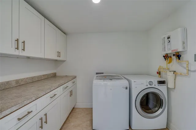 a bathroom with a granite countertop toilet a sink and mirror
