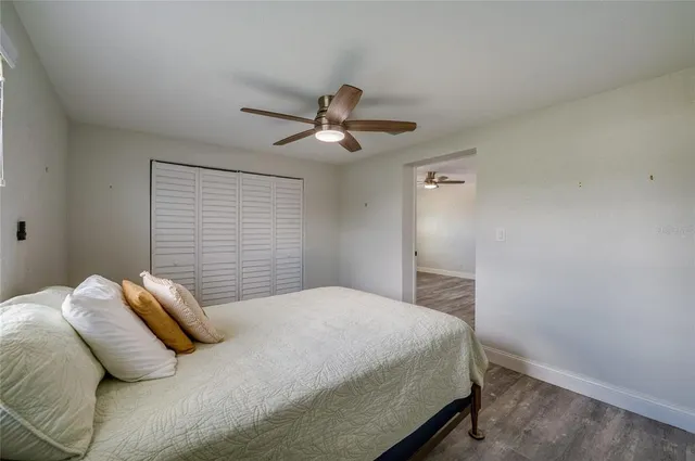 a bathroom with a granite countertop sink vanity and mirror
