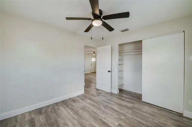 a view of a lobby with chair and wooden floor