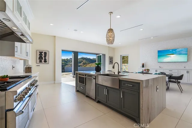 a bedroom with a large bed and wooden floor