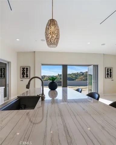a bathroom with a granite countertop sink a mirror a vanity and shower