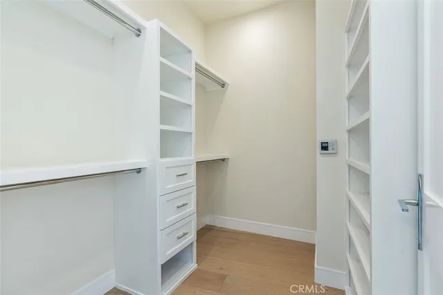 a spacious bathroom with a double vanity sink mirror and bathtub