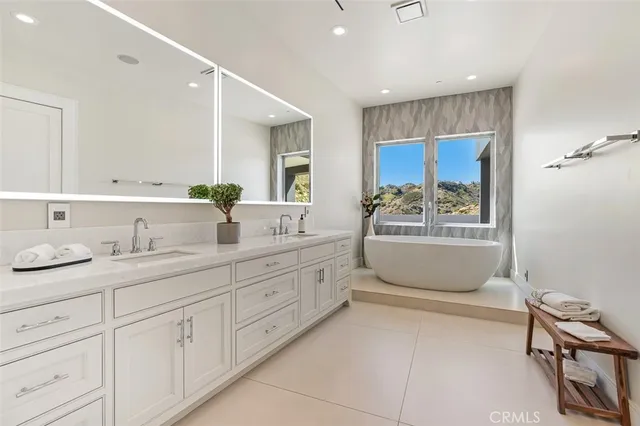 a utility room with sink dryer and washer