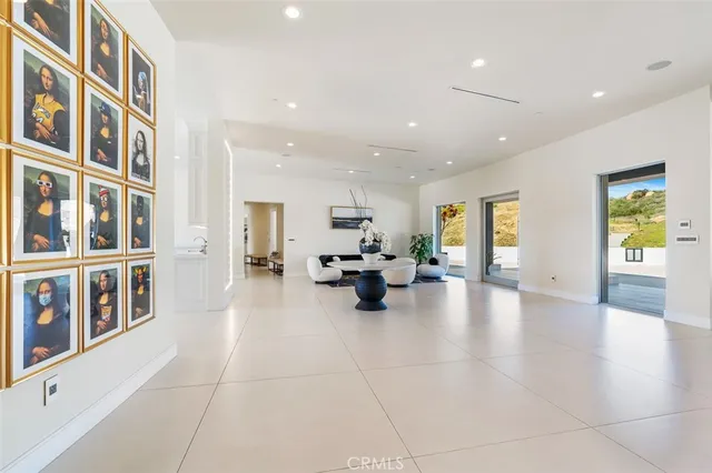 a living room with furniture and white walls