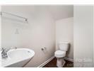 13206 Erwin Road Charlotte, NC 28273 - Photo 13 of 26 a bathroom with a toilet and a sink