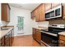 13206 Erwin Road Charlotte, NC 28273 - Photo 14 of 26 a kitchen with stainless steel appliances a stove microwave and sink