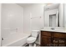 13206 Erwin Road Charlotte, NC 28273 - Photo 7 of 26 a bathroom with a sink toilet a mirror and vanity