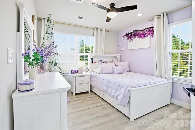 a bedroom with a bed and a table