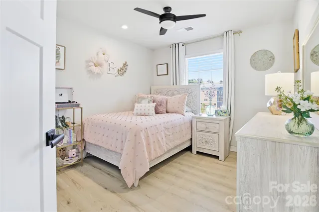 a bedroom with a bed and a table