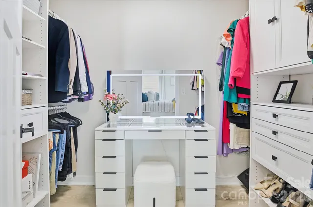 a view of a kitchen with appliances and furniture
