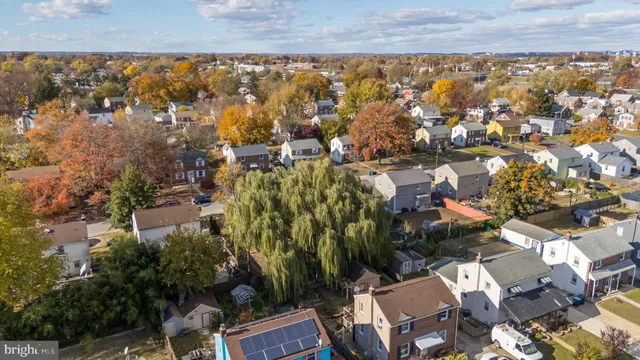 a front view of a building with a garden