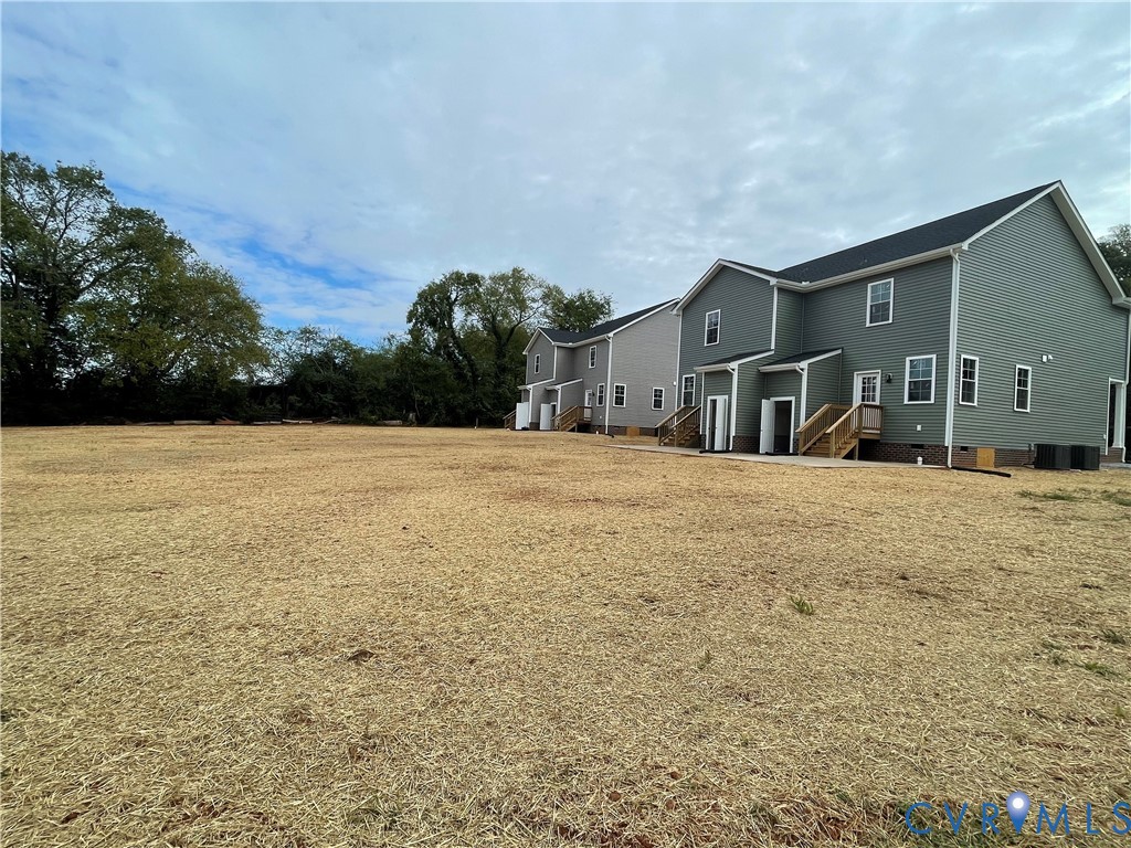 12234 Old Chula Road, Unit 2 Amelia Court House, VA 23002 - Photo 3 of 13 a view of house with yard and trees in the background