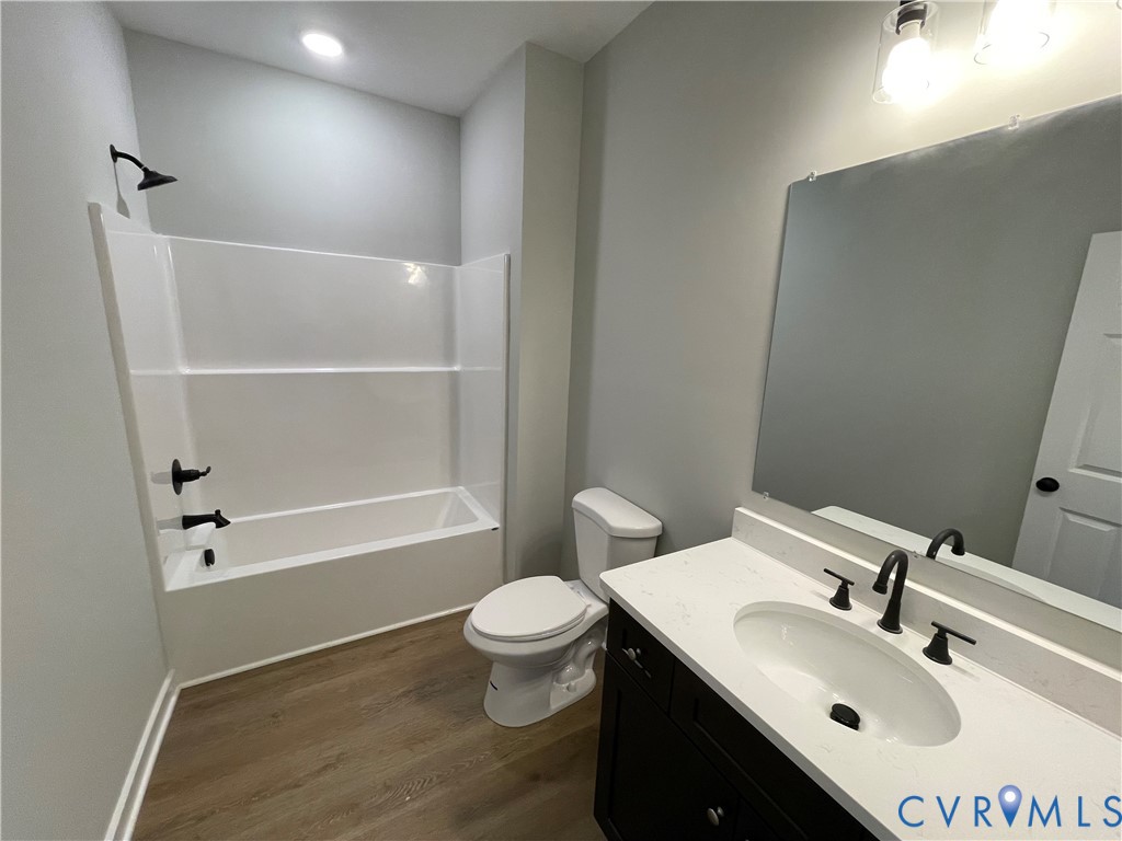 12234 Old Chula Road, Unit 2 Amelia Court House, VA 23002 - Photo 7 of 13 a bathroom with a sink toilet and shower