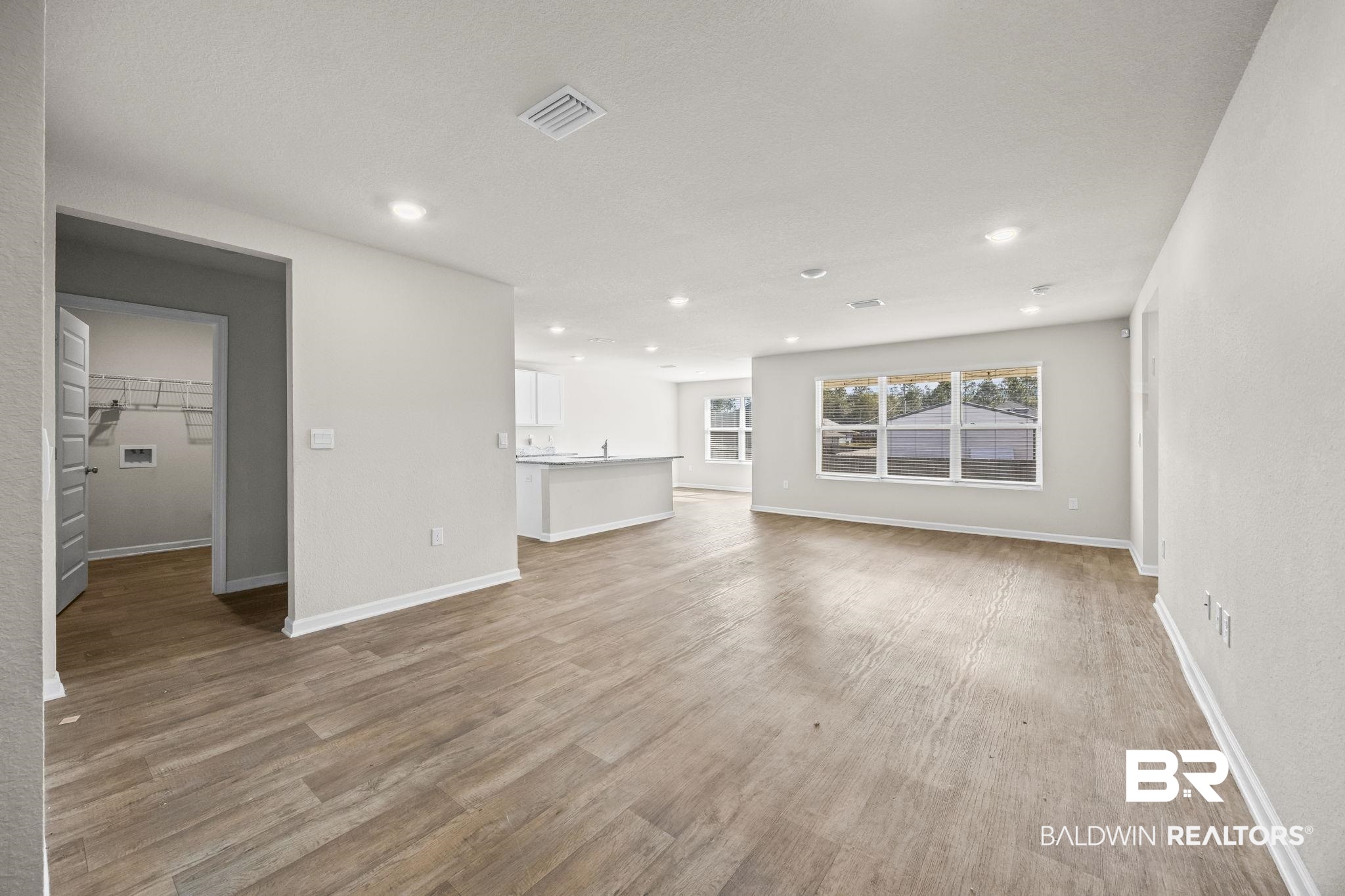 3090 Camino Real Loop Lillian, AL 36549 - Photo 9 of 29 Unfurnished living room featuring light wood-style floors and recessed lighting