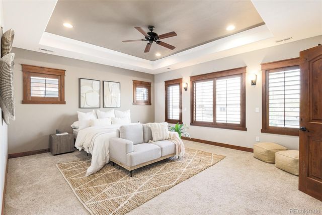 a bedroom with a bed and a fireplace