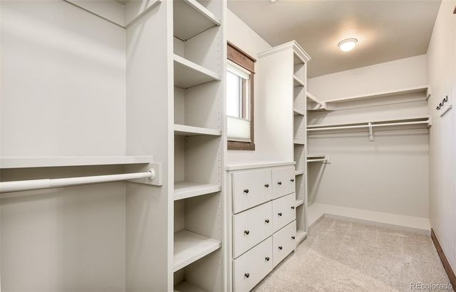 a view of a hallway with windows and stairs