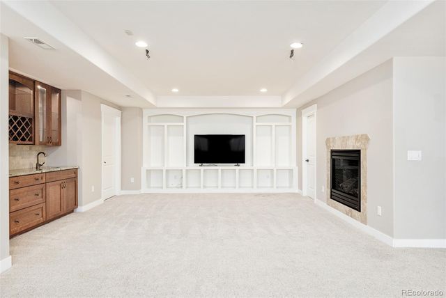 a view of an empty room with a fireplace