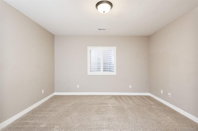 a living room filled with furniture and a large window