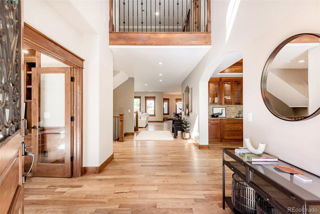 a lobby with furniture and wooden floor