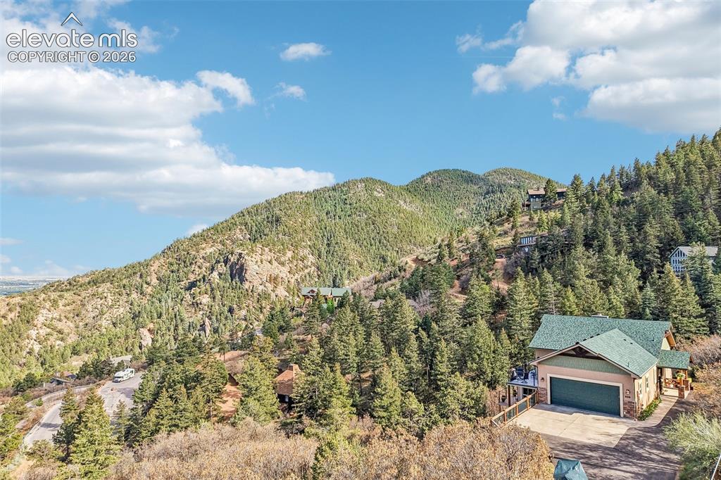 858 Oak Ridge Road Manitou Springs, CO 80829 - Photo 1 of 50 View of this home nestled into the mountain with 360 degree views!