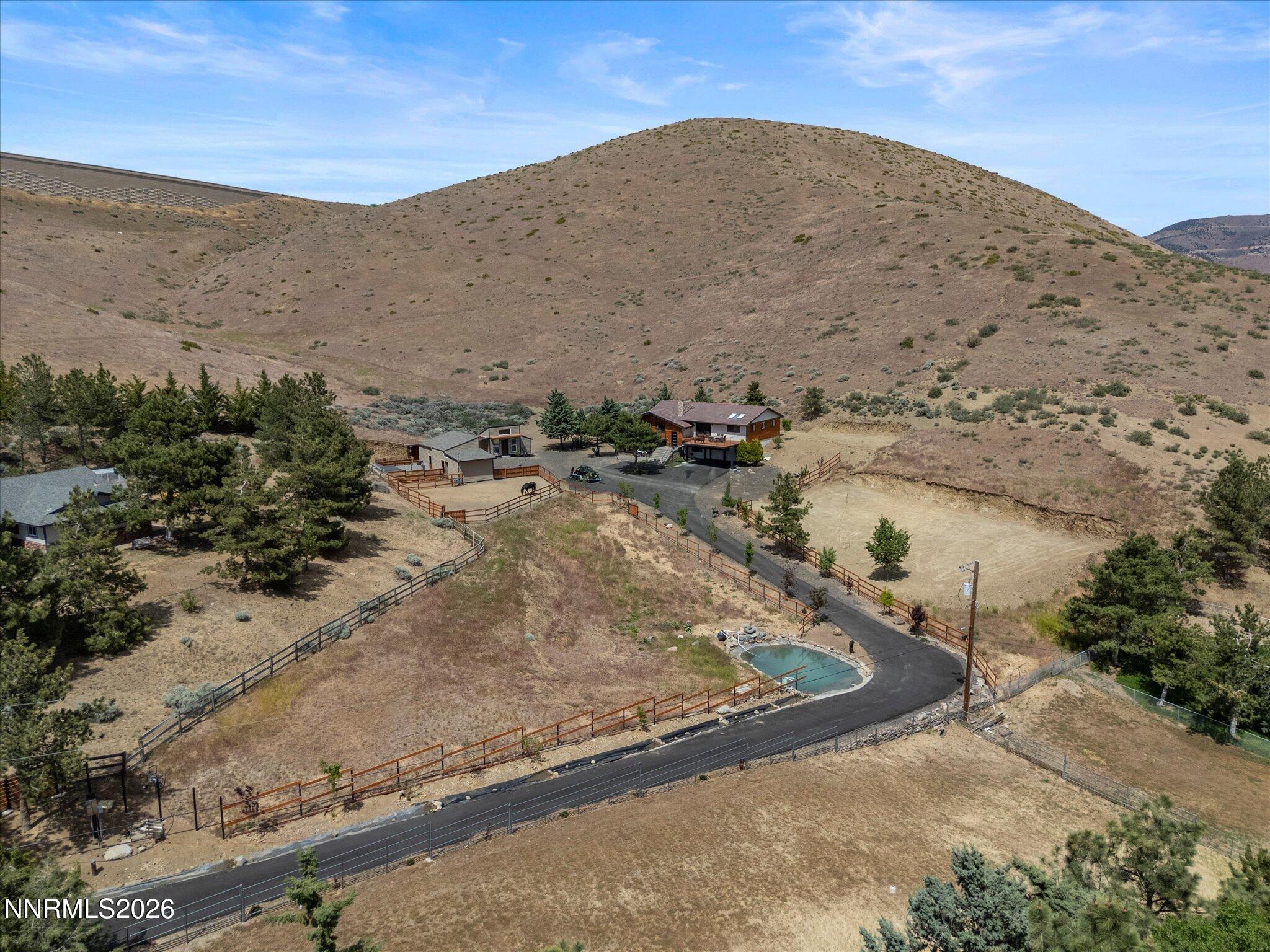 20449 Temelec Way Reno, NV 89521 - Photo 3 of 65 a view of a dry yard with a mountain
