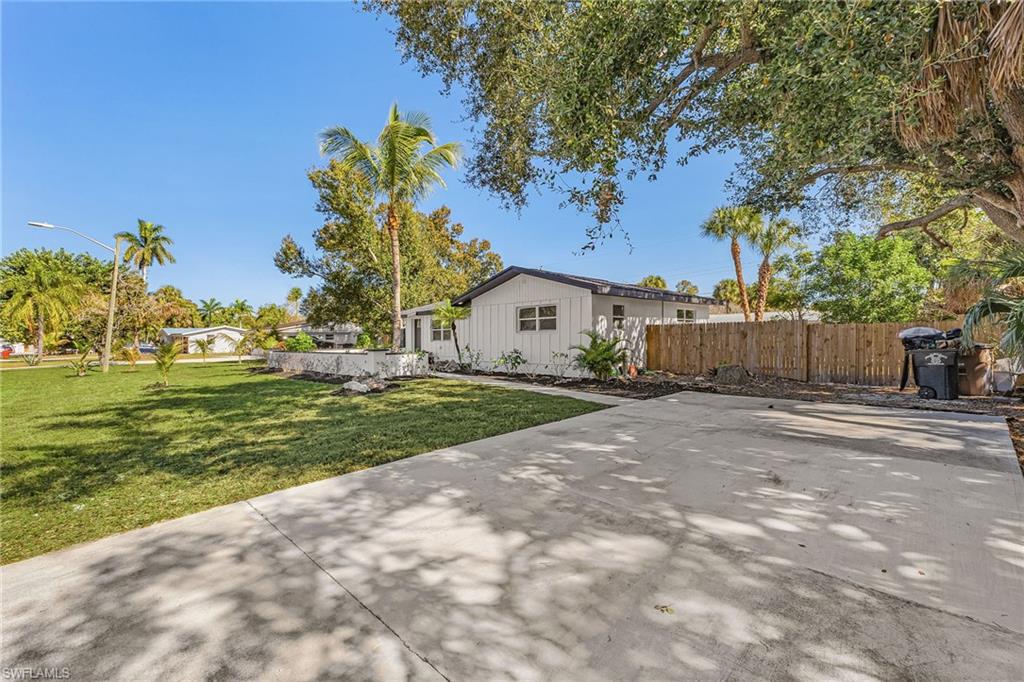 3843 Marvaez Street Fort Myers, FL 33901 - Photo 2 of 26 a view of a house with a yard
