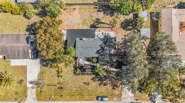 a aerial view of a house with a yard