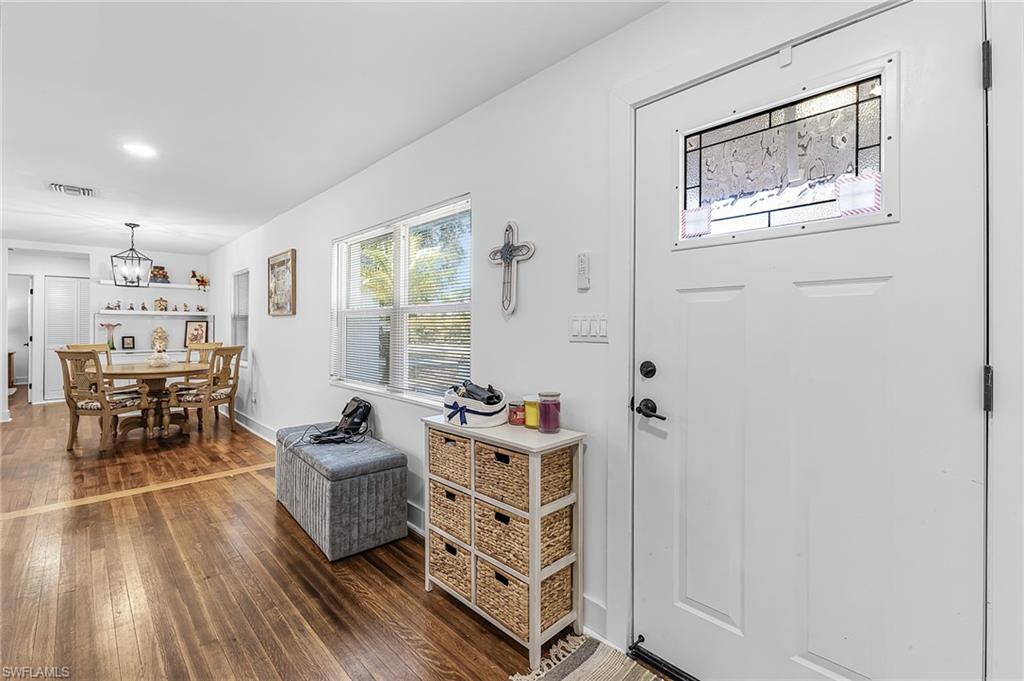 3843 Marvaez Street Fort Myers, FL 33901 - Photo 5 of 26 a bedroom with furniture and wooden floor