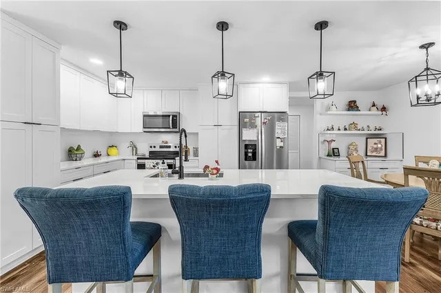 a dining room with furniture a window and kitchen view