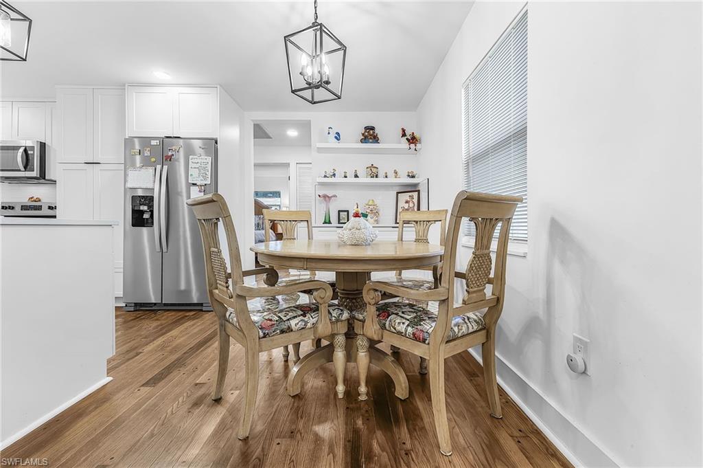 3843 Marvaez Street Fort Myers, FL 33901 - Photo 10 of 26 a view of a dining room with furniture and wooden floor