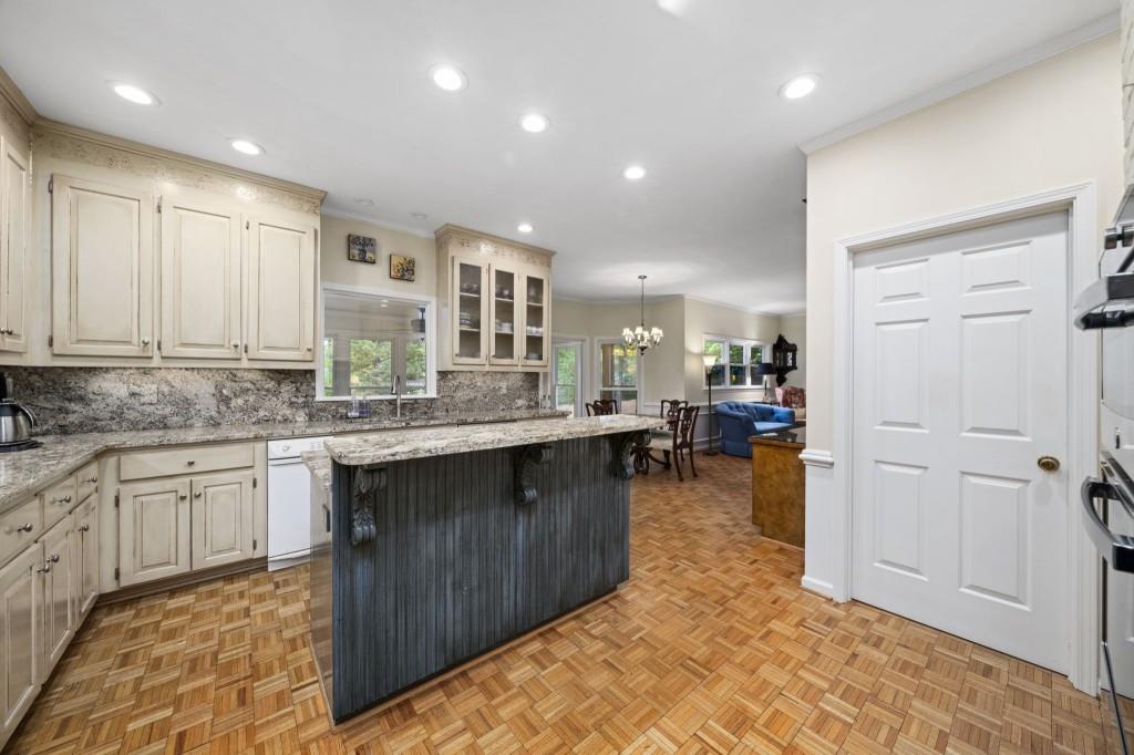300 Waterpine Court Sandy Springs, GA 30350 - Photo 15 of 53 a kitchen with stainless steel appliances granite countertop a refrigerator and a sink