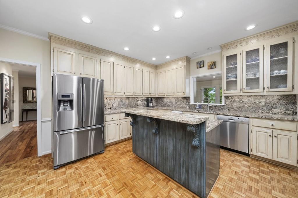 300 Waterpine Court Sandy Springs, GA 30350 - Photo 16 of 53 a kitchen with stainless steel appliances granite countertop a refrigerator and a sink