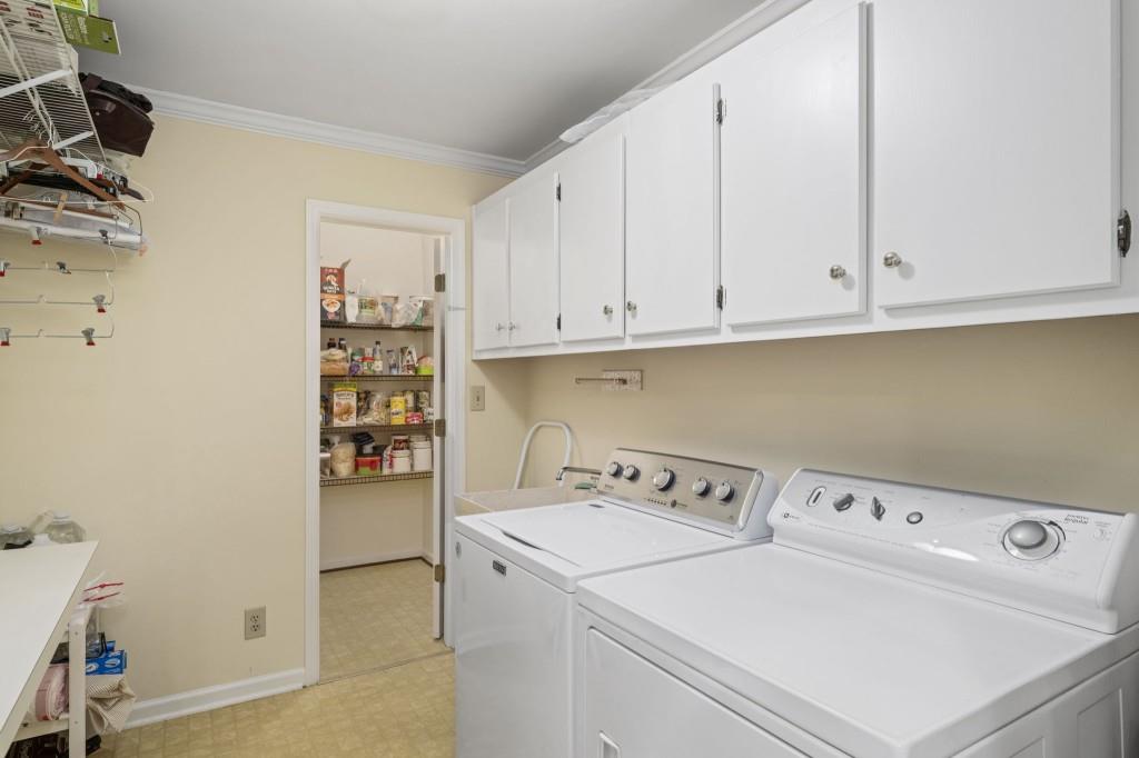 300 Waterpine Court Sandy Springs, GA 30350 - Photo 19 of 53 a utility room with dryer and washer