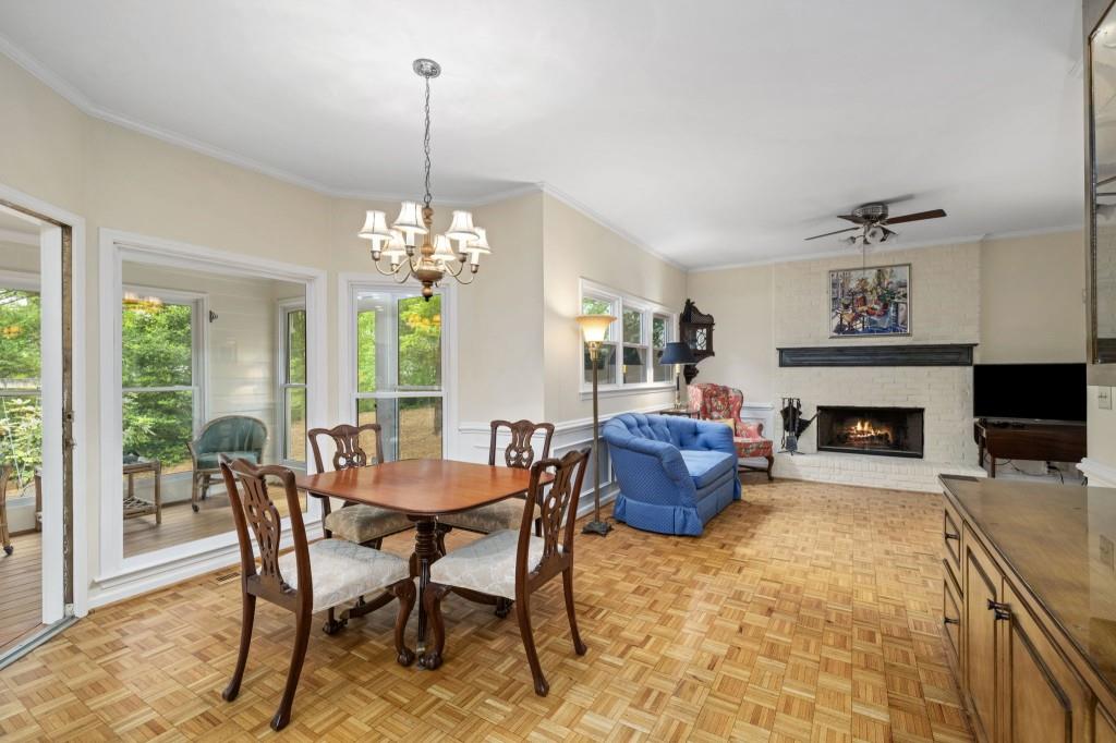 300 Waterpine Court Sandy Springs, GA 30350 - Photo 20 of 53 a dining room with furniture a fireplace and a chandelier