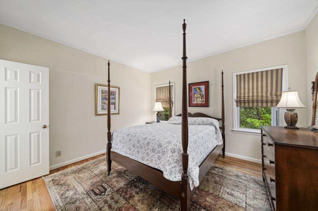 300 Waterpine Court Sandy Springs, GA 30350 - Photo 26 of 53 a bedroom with a bed and wooden floor