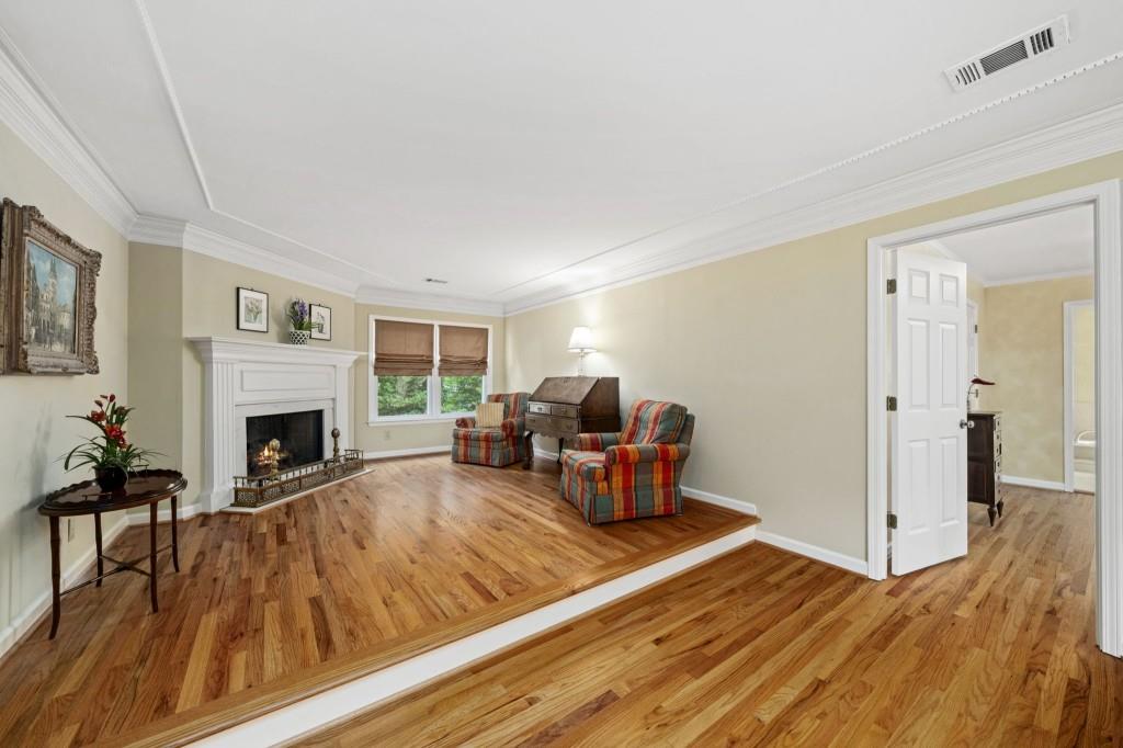 300 Waterpine Court Sandy Springs, GA 30350 - Photo 30 of 53 a living room with furniture and a fireplace