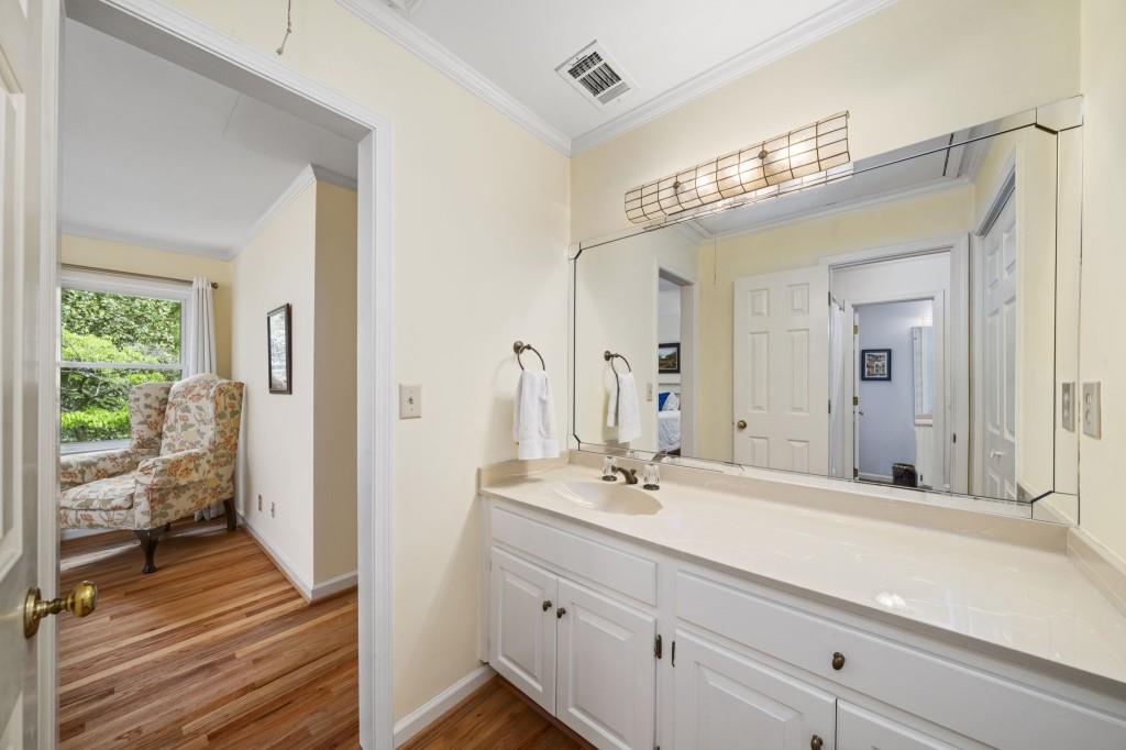 300 Waterpine Court Sandy Springs, GA 30350 - Photo 38 of 53 a spacious bathroom with a double vanity sink and a mirror