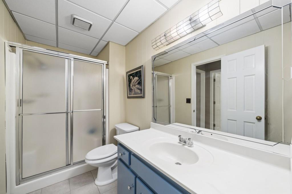 300 Waterpine Court Sandy Springs, GA 30350 - Photo 44 of 53 a bathroom with a sink toilet and shower