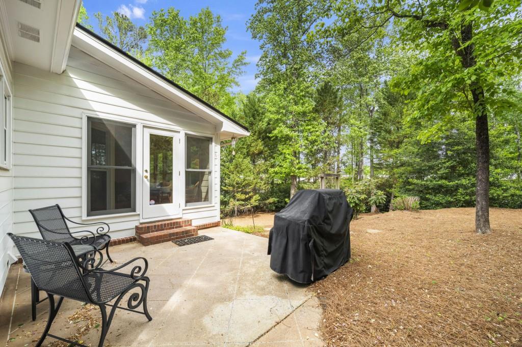 300 Waterpine Court Sandy Springs, GA 30350 - Photo 45 of 53 a view of a patio with table and chairs and potted plants
