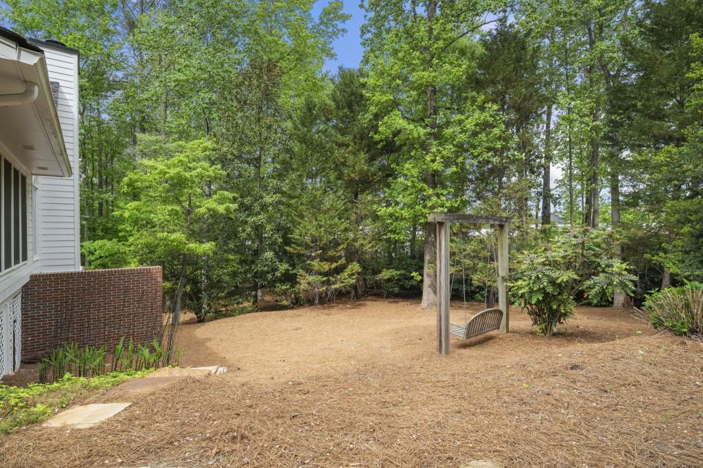 300 Waterpine Court Sandy Springs, GA 30350 - Photo 46 of 53 a backyard of a house with plants and large trees