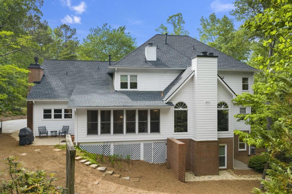 300 Waterpine Court Sandy Springs, GA 30350 - Photo 47 of 53 a front view of a house with a yard