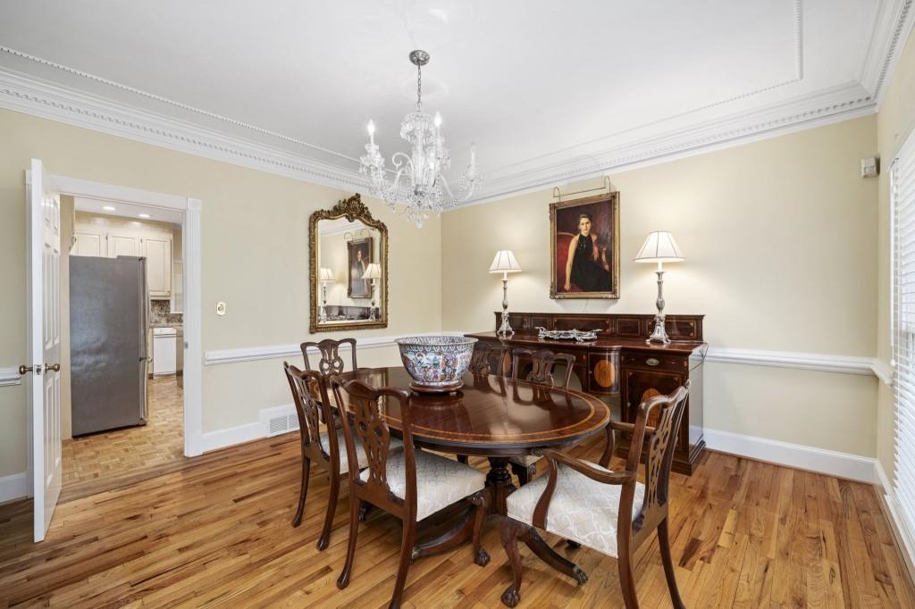 300 Waterpine Court Sandy Springs, GA 30350 - Photo 7 of 53 a view of a dining room with furniture wooden floor and chandelier