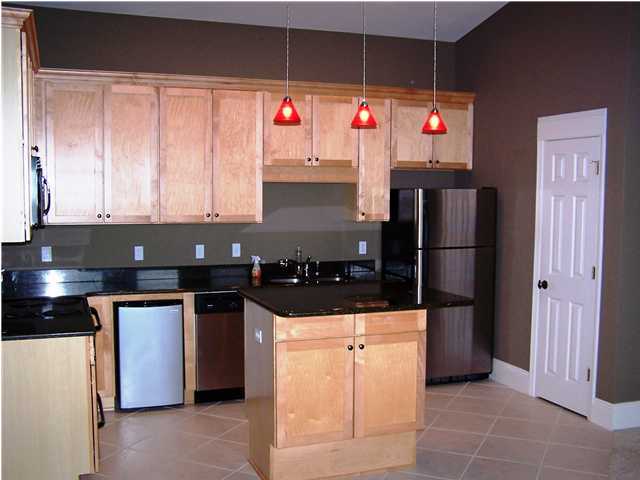 122 Shorebird Drive Santa Rosa Beach, FL 32459 - Photo 1 of 6 a kitchen with granite countertop a stove and a refrigerator