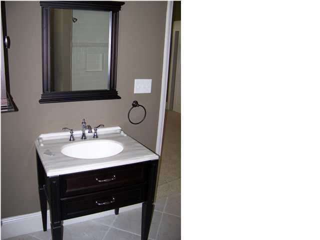 122 Shorebird Drive Santa Rosa Beach, FL 32459 - Photo 4 of 6 a bathroom with a sink and a mirror