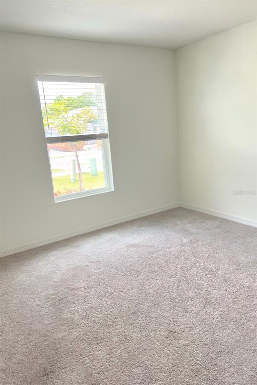 851 Alminar Avenue Southeast Palm Bay, FL 32909 - Photo 13 of 13 an empty room with a window