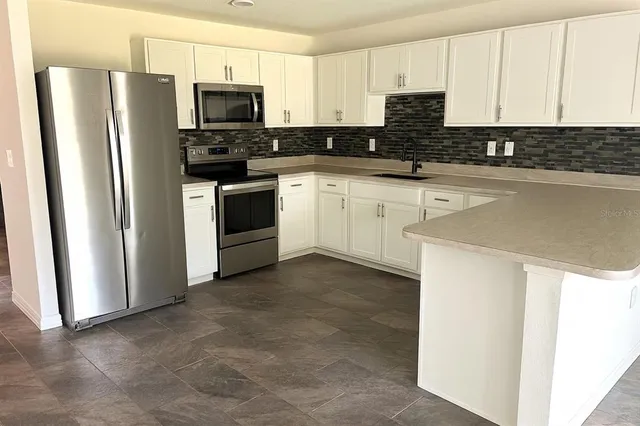a bathroom with a toilet a sink and shower