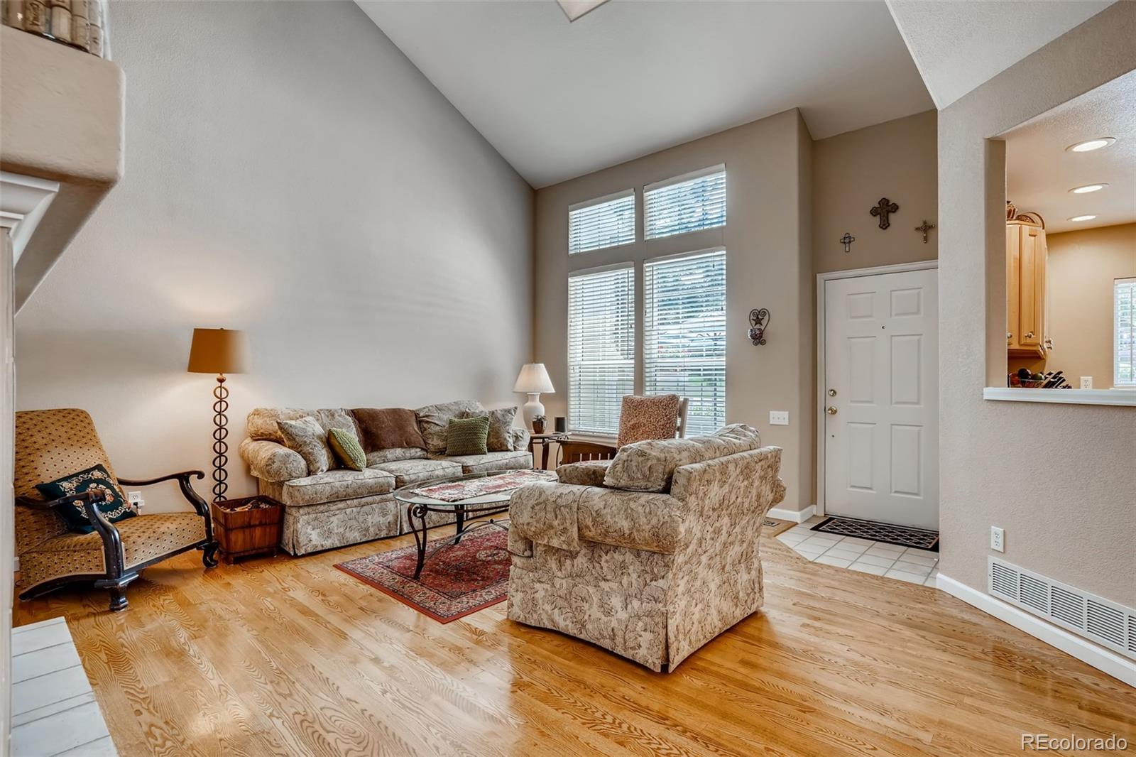 6123 Trailhead Road Highlands Ranch, CO 80130 - Photo 3 of 26 a living room with furniture and a large window