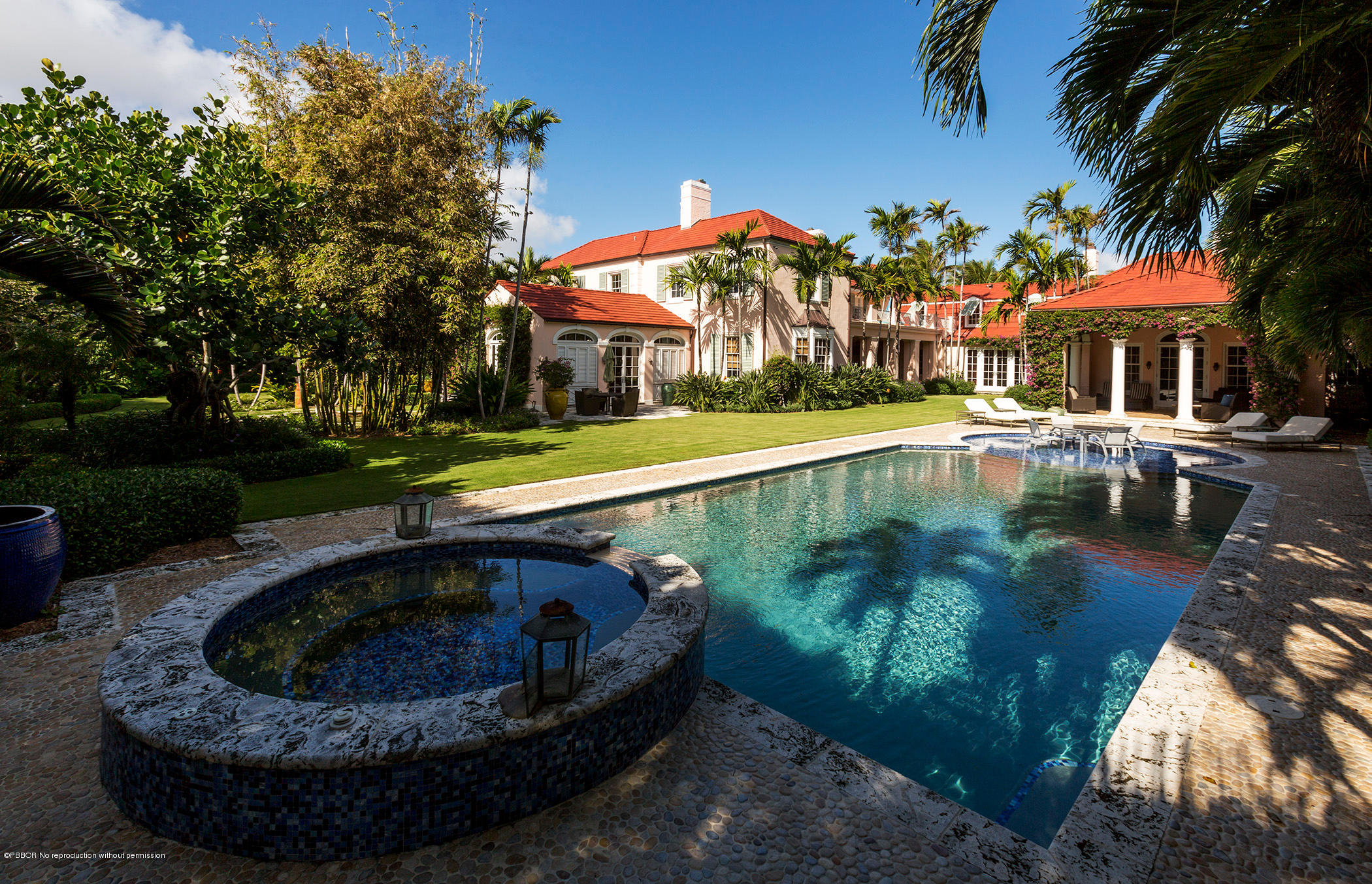 5 Middle Road Palm Beach, FL 33480 - Photo 4 of 7 a view of a swimming pool with a patio