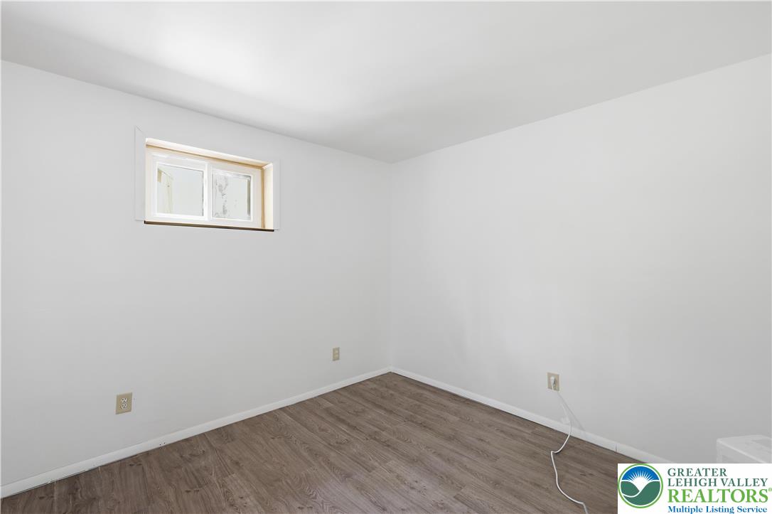 505 Chipmunk Road Bushkill, PA 18324 - Photo 22 of 46 a view of a room with wooden floor and white walls
